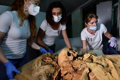 Researchers prepare to move the Egyptian mummy from the Civic Archaeological Museum of Bergamo to Milan's Policlinico hospital. Reuters