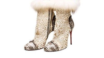 Fur and lace cutout ankle boots from Christian Louboutin.