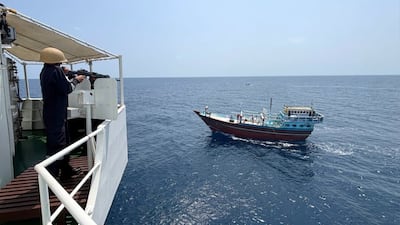 Indian Coast Guard personnel approach the dhow in the Arabian Sea. Photo: Indian Coast Guard