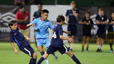 Minerva Academy (light blue) take on La Liga Academy.