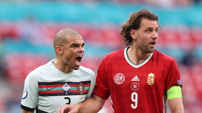Portugal's Pepe shouts in the ear of Adam Szalai of Hungary. Reuters