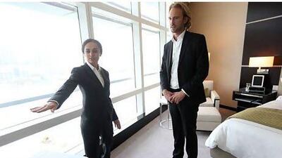 "For us, all guests are VIPs," says the Rosewood Abu Dhabi butler Nona Zazikashvili, here helping hotel guest Frederic Robert. Sammy Dallal / The National