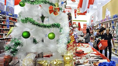 Shoppers look for Christmas decorations in the Geant store in Ibn Battuta Mall in Dubai City. Jeff Topping/For The National