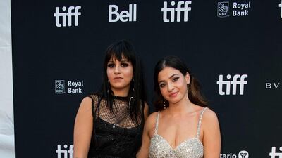 Syrian sisters Sarah Mardini, left, and Yusra Mardini arrive for 'The Swimmers' premiere at Roy Thomson Hall. AFP