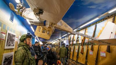 Journalists look at drones aboard the train that has begun a journey throughout Russia. AP Photo