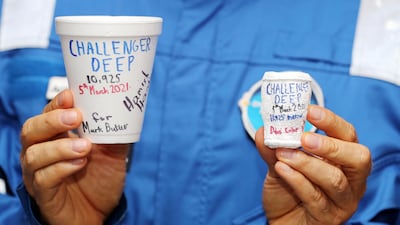 Explorer Hamish Harding shows what deep atmospheric pressure can do a polystyrene cup. Chris Whiteoak / The Nationa