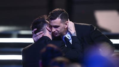 Argentina and Aston Villa goalkeeper Emiliano Martinez, right, is congratulated by Lionel Messi after receiving the Best Fifa Men’s Goalkeeper award. EPA