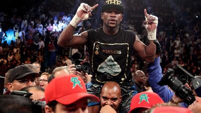 Floyd Mayweather Jr was 'shocked' that one fight judge has his majority decision victory over Saul Alvarez as 'even'. John Gurzinski / AFP