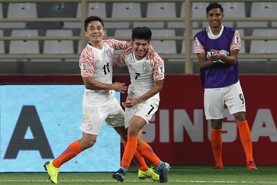 India's forward Sunil Chhetri, left, and midfielder Anirudh Thaparight, celebrate their sides third goal in the thumping 4-1 win over Thailand. AP