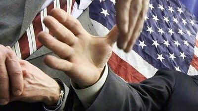 Most people, when meeting someone new, introduce themselves with their work details. Elise Amendola / AP Photo