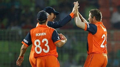 The Netherlands bowlers celebrate the wicket of UAE opener Faizan Asif that started the slide for the side, who won the toss. AM Ahad / AP Photo / March 17, 2014