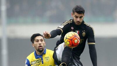 Juventus' Alvaro Morata, right, controls the ball against Chievo Verona. REUTERS/Alessandro Garofalo