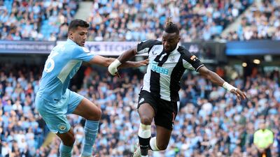 Newcastle attacker Allan Saint-Maximin under pressure from City's Rodri. Reuters