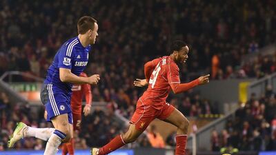Liverpool's Raheem Sterling breaks past Chelsea defender John Terry during their League Cup semi-final first-leg match on Tuesday. Paul Ellis / AFP / January 20, 2015