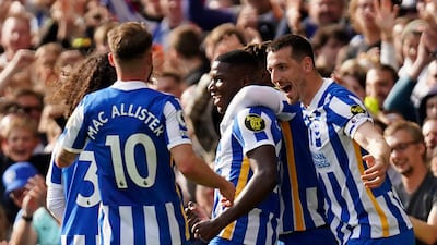 Brighton and Hove Albion's Moises Caicedo, centre, celebrates scoring. AP