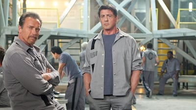 Arnold Schwarzenegger, left, and Sylvester Stallone star in Escape Plan. Photo by Alan Markfield © 2013 Summit Entertainment, LLC. All rights reserved.