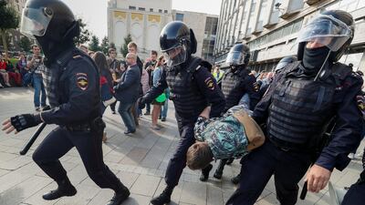 Law enforcement officers detain a participant in a rally calling for opposition candidates to be registered for elections to Moscow City Duma, the capital's regional parliament, in Moscow, Russia August 3, 2019. Reuters