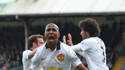 Manchester United midfielder Ashley Young celebrates after Marouane Fellaini scored his team's second goal during the Premier League match against Crystal Palace at Selhurst Park in London on May 9, 2015. Glyn Kirk / AFP