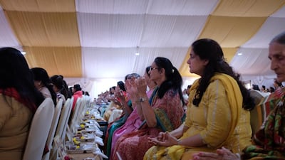 People attend the foundation stone laying ceremony.