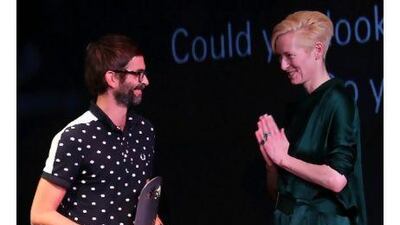 The actor Tilda Swinton congratulates French writer/director Vincent Paronnaud, who won an award at the closing ceremony of the Abu Dhabi Film Festival. In letters today, readers praise the festival. Karim Sahib / AFP