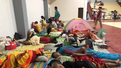 Residents bed down for the night at the sports complex. Photo: AFP