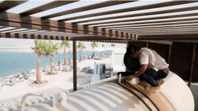 A maintenance technician at Royal Island Beach Club checks the diesel tank that holds fuel for the resort's generators.