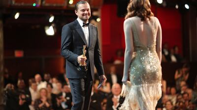 Leonardo DiCaprio presents Emma Stone with the Best Actress Oscar for La La Land at the 89th Academy Awards on February 26, 2017. AFP
