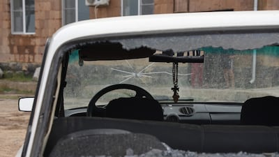 A wrecked car in the Armenian settlement of Yeraskh, on the border with Azerbaijan, after recent shelling. AFP