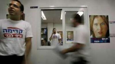 Supporters of Tzipi Livni prepare for today's Kadimi party vote. Opinion polls suggest the foreign minister will win the leadership ballot.