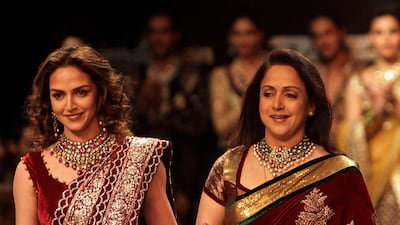 August 19, 2011: Bollywood actress Hema Malini, right, and her daughter Esha Deol display creations by designers Shyamal and Bhumika during Lakme Fashion Week in Mumbai. AP Photo/Rajanish Kakade