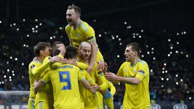 Astana players celebrate after Manchester United's Di'Shon Bernard scores an own goal. Reuters