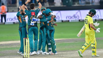 Pakistan cricketers celebrate after victory in the second T20 cricket match between Pakistan and Australia at The International Cricket Stadium in Dubai on October 26, 2018. / AFP / GIUSEPPE CACACE