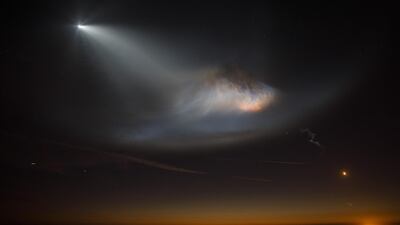 A SpaceX Falcon 9 rocket flies above Manhattan Beach, California. Bloomberg