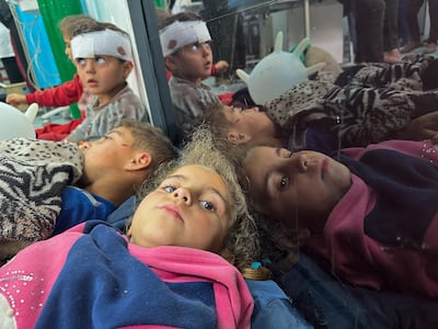 Palestinian children wounded in an Israeli strike rest as they receive treatment at a hospital in Rafah on Monday. Reuters