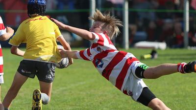 The Heartbeat Sports Tigers make the stretch to stop a Hurricanes player during game action on Friday, January 22, 2016, at the HSBC Rugby Festival Dubai. DELORES JOHNSON / The National