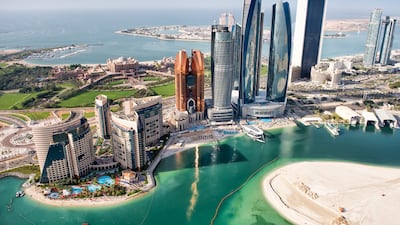 Abu Dhabi's skyline. The legal changes also regulate delocalisation of UAE companies. Getty Images