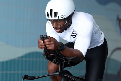 Ghani Souleymane sells running shoes in Dubai Mall as his day job. Chris Whiteoak / The National