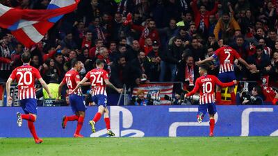 Diego Godin runs off the celebration after scoring Atletico Madrid's second goal. Reuters