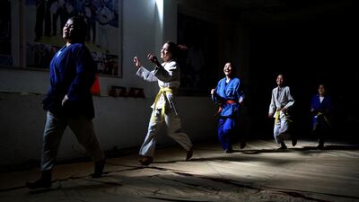 Members of Jiu Jitsu club run during a training session in Kabul. AP