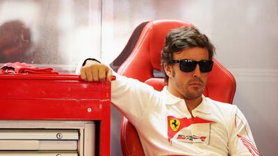 Fernando Alonso waits in the Ferrari garage for the signal to drive during final practice. Mark Thompson/Getty Images