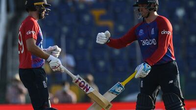 England's Jason Roy, right, with Dawid Malan during the T20 World Cup match against Bangladesh at the Zayed Cricket Stadium in Abu Dhabi on Wednesday, October 27, 2021. AFP