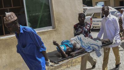 One of the victims of the double bombing in Molai is rushed to hospital in Maiduguri, Nigeria on October 16, 2015. EPA/STR