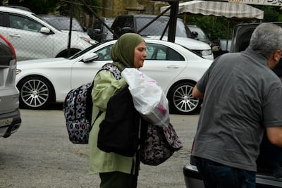 People leave Beirut's southern suburbs after Israel ordered strikes on the Dahieh district. EPA