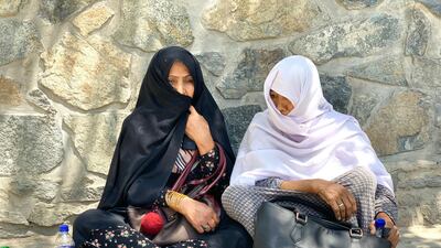 Afghans look for the names of their relatives and friends outside the emergency trauma hospital in Kabul. An ISIS suicide bomber detonated himself in a crowded wedding hall in the Afghan capital on Saturday night, killing 63 and injuring 180 guests. Hikmat Noori for The National