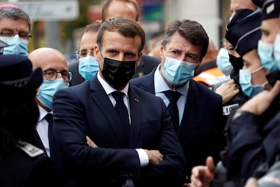 President Emmanuel Macron (L) and Nice Mayor Christian Estrosi at the Notre Dame church. EPA