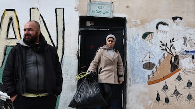 Members of a Palestinian family outside their house in the Silwan neighbourhood, part of the Bustan clearance, outside the walls of Jerusalem's Old City. EPA