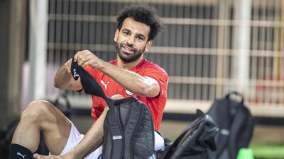 Egypt's forward Mohamed Salah puts his socks on during a training session. AFP
