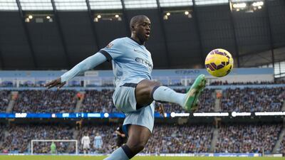 Manchester City's Ivorian midfielder Yaya Toure controls the ball during the English Premier League football match between Manchester City and Swansea City at the The Etihad Stadium. AFP PHOTO/OLI SCARFF