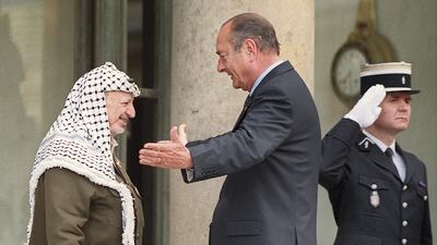 French President Jacques Chirac (centre) welcomes Palestinian leader Yasser Arafat (left) before their meeting at the Elysee Palace in Paris on May 23, 2001. AFP