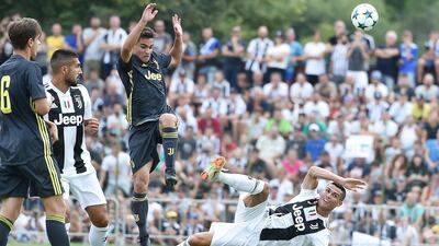 Ronaldo challenges for the ball. EPA